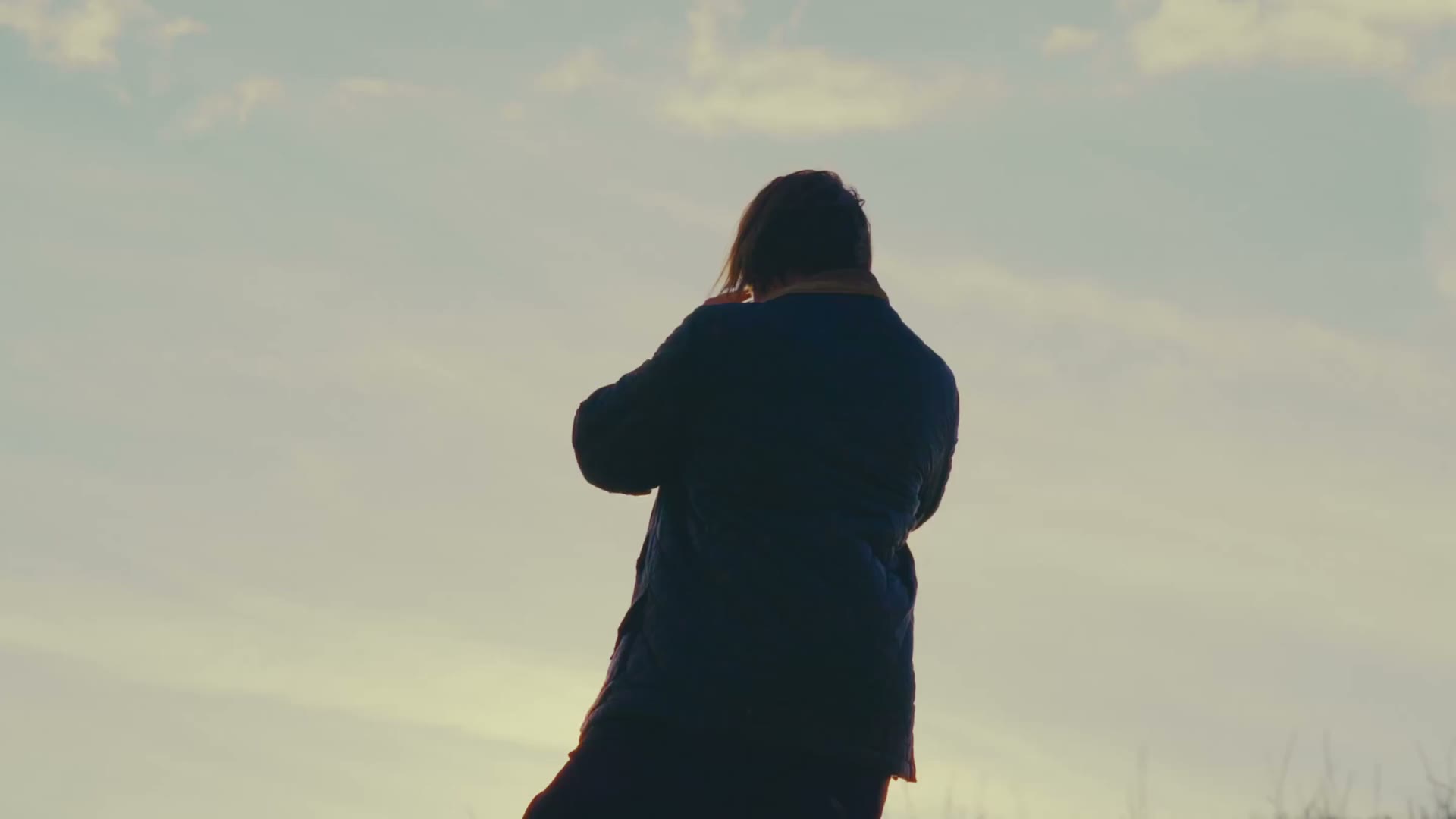 Monty Hancock in silhouette against the sky